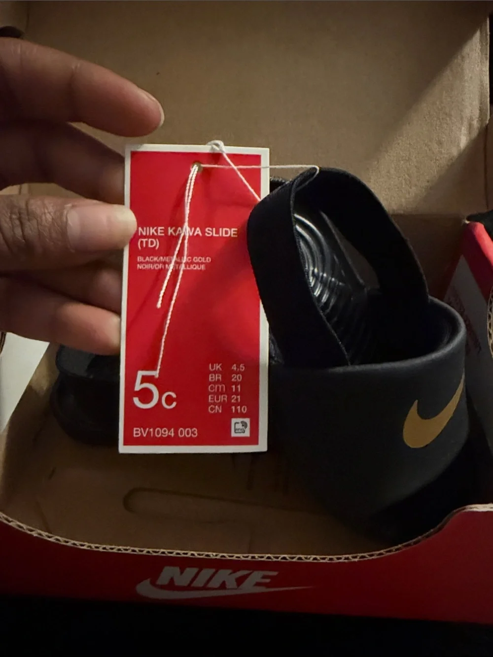 Nike Kids Black Slides with Metallic Gold Swoosh